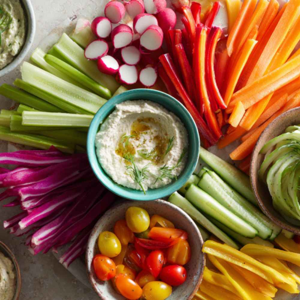 crudite platter with carrots, cucumber, radishes, tomatoes and a low calorie dip sauce